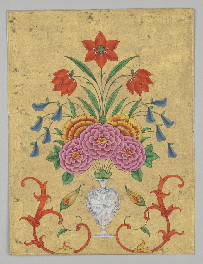 Vase with flower arrangement and scrollwork