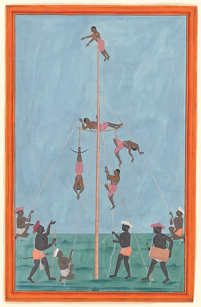 A troupe of acrobats performing daring feats